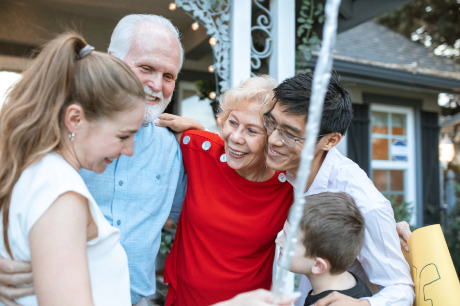 happy family in front of a house